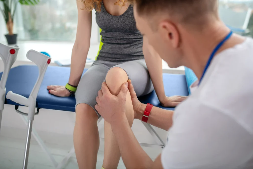 Professional treating or assessing an active patient's knee