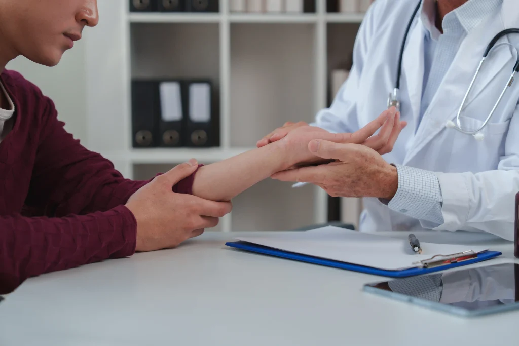 Healthcare professional examining a patient with carpal tunnel syndrome