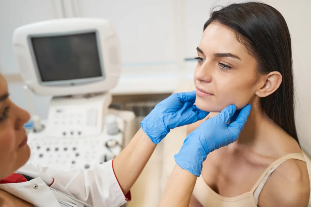 Chiropractor performing a physical examination for stiff neck pain