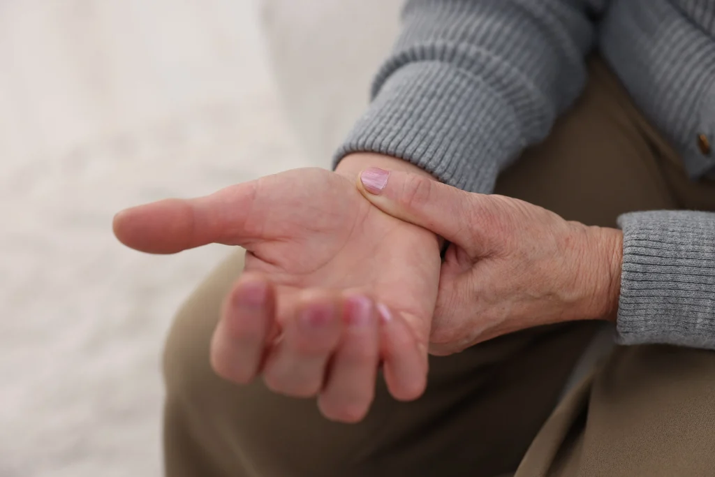 Person experiencing hand numbness and wrist pain