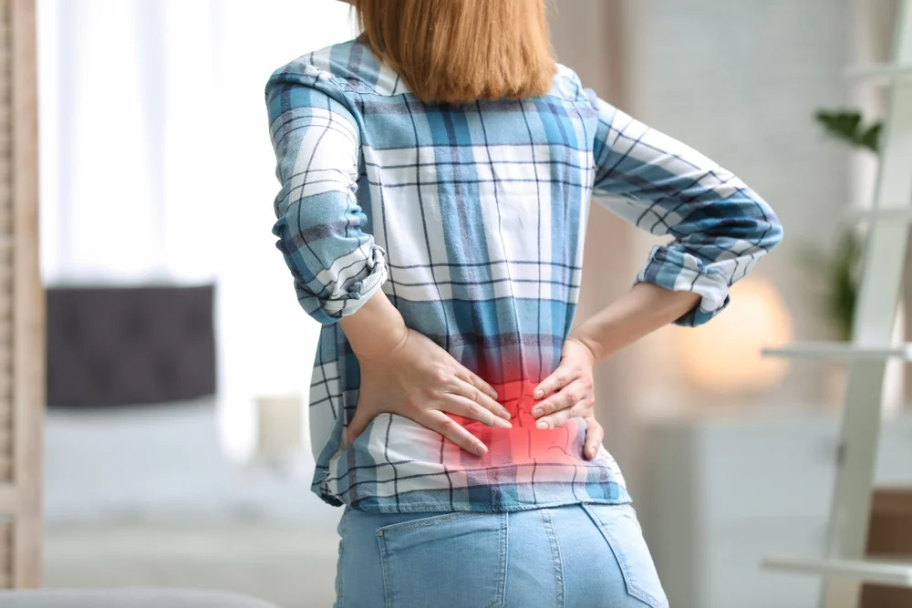 Woman experiencing lower back pain