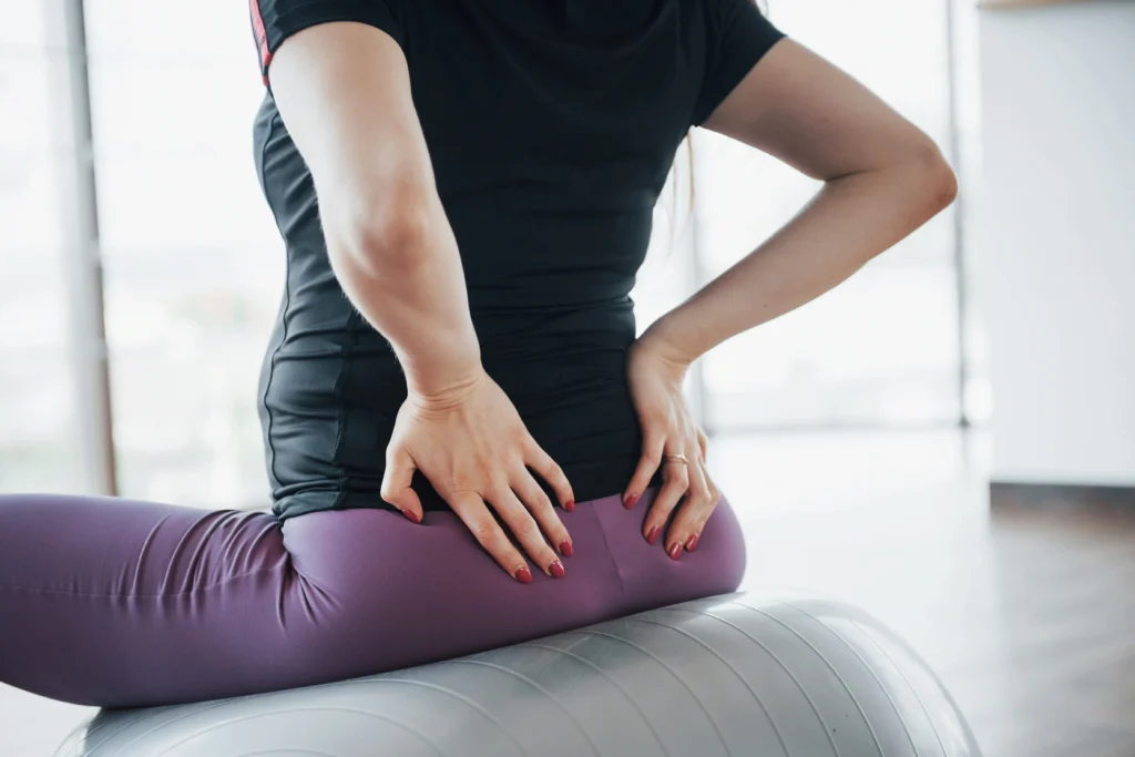 young pregnant women sitting ball exercises gym - How Long Does Sciatica Last Without Treatment? - Apex Chiropractic